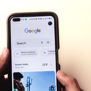 Men typing in the Google search engine from realme 6 pro. "Google" is the number one search web.